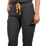 Close up of the left side pocket of the Pfeiffer scrub pants in charcoal gray.