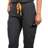 Close up of the left side pocket of the Pfeiffer scrub pants in charcoal gray.