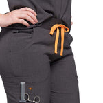 Lower front close up picture of the the Pfeiffer scrub pants in charcoal gray.