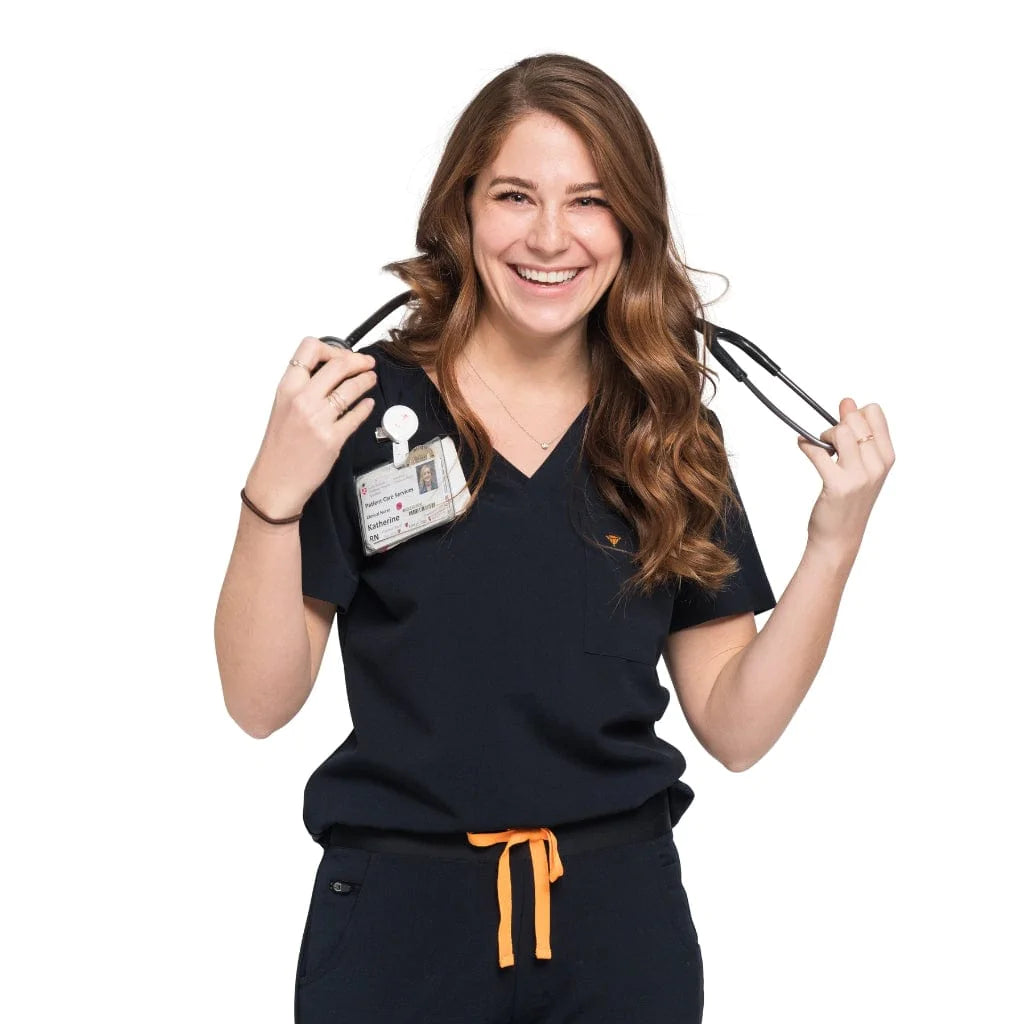 Front shot of the wilder one-pocket scrub top in black.