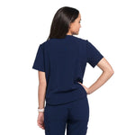 Back picture of the wilder one-pocket scrub top in navy.