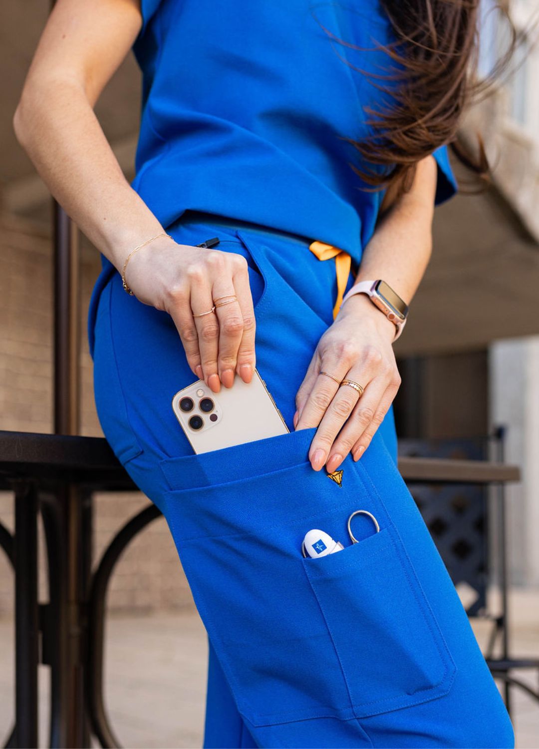 Poppy women's scrubs in blue have functional pockets.