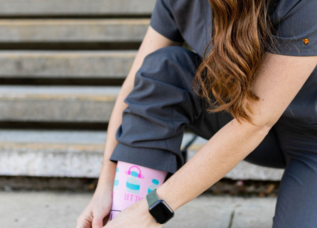 Kneeling photo of poppy scrubs compression socks.