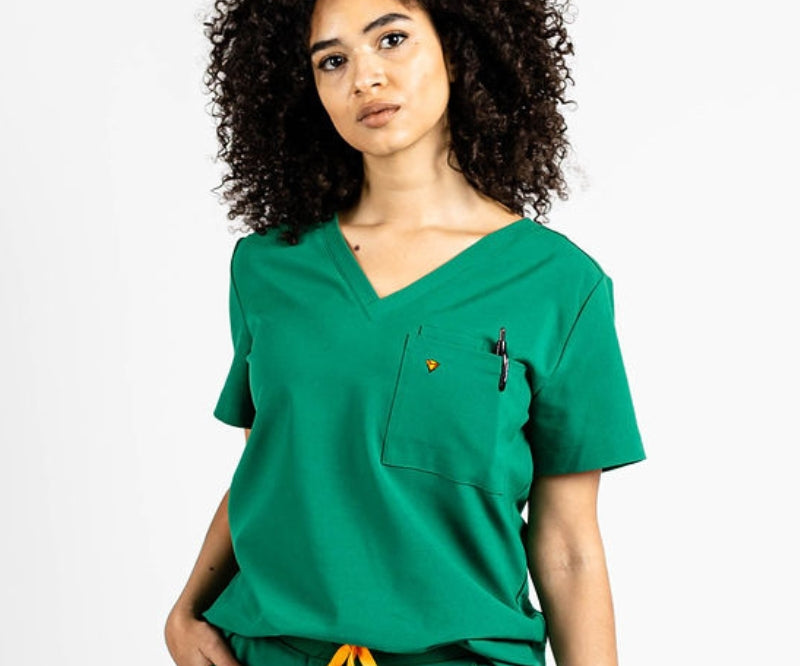 the wilder one pocket scrub top for women in dark green