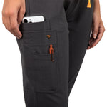 Close up of the pockets on the right side of the  Pfeiffer scrub pants in charcoal gray.