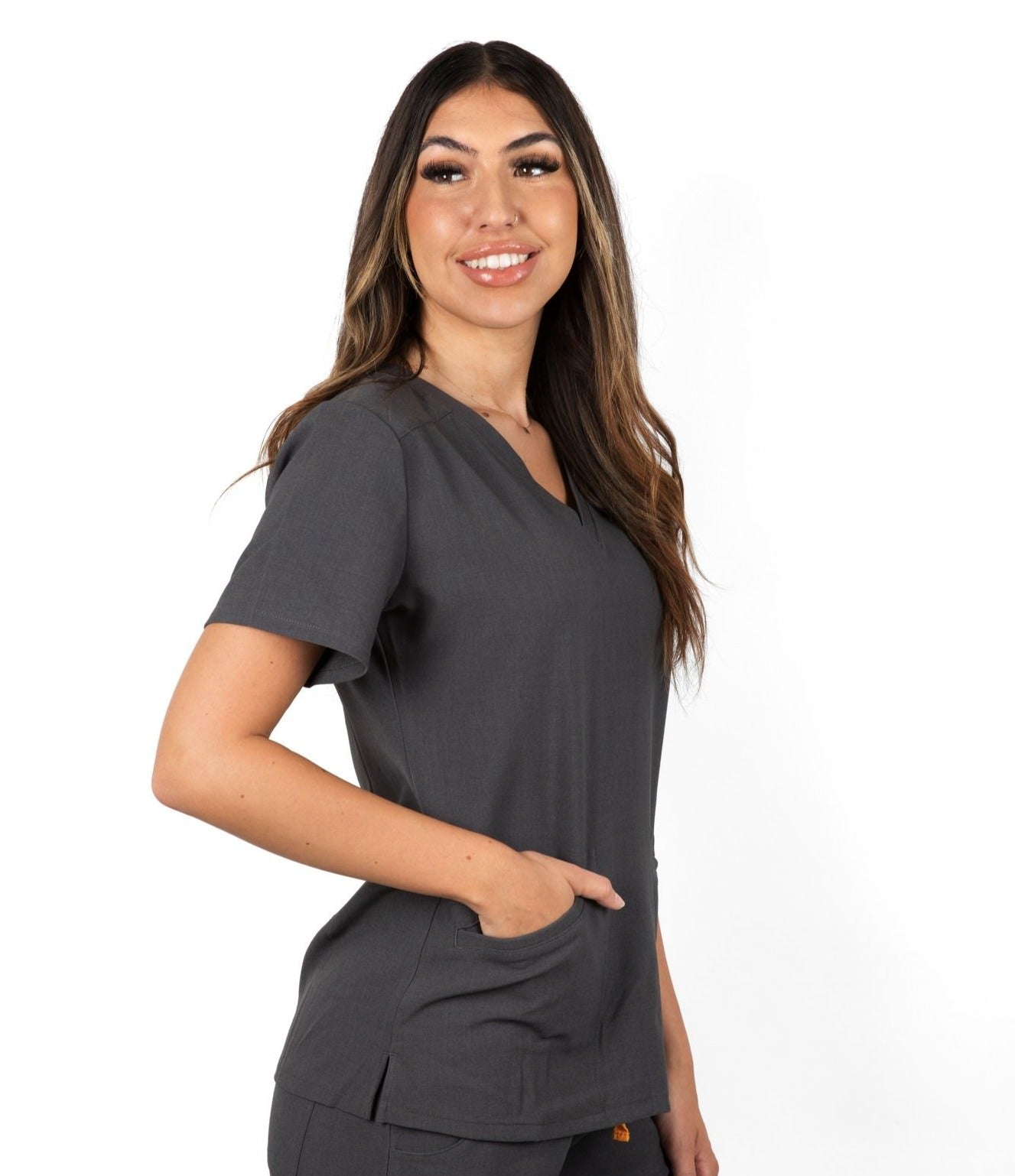 Upper right front picture of the Caswell scrub top in charcoal gray.