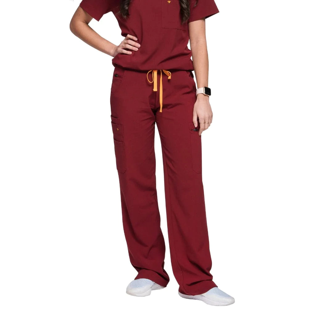 Front picture of the the Bodie scrub pants in burgundy.