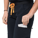 Close up pocket picture of the the Bodie scrub pants in black.