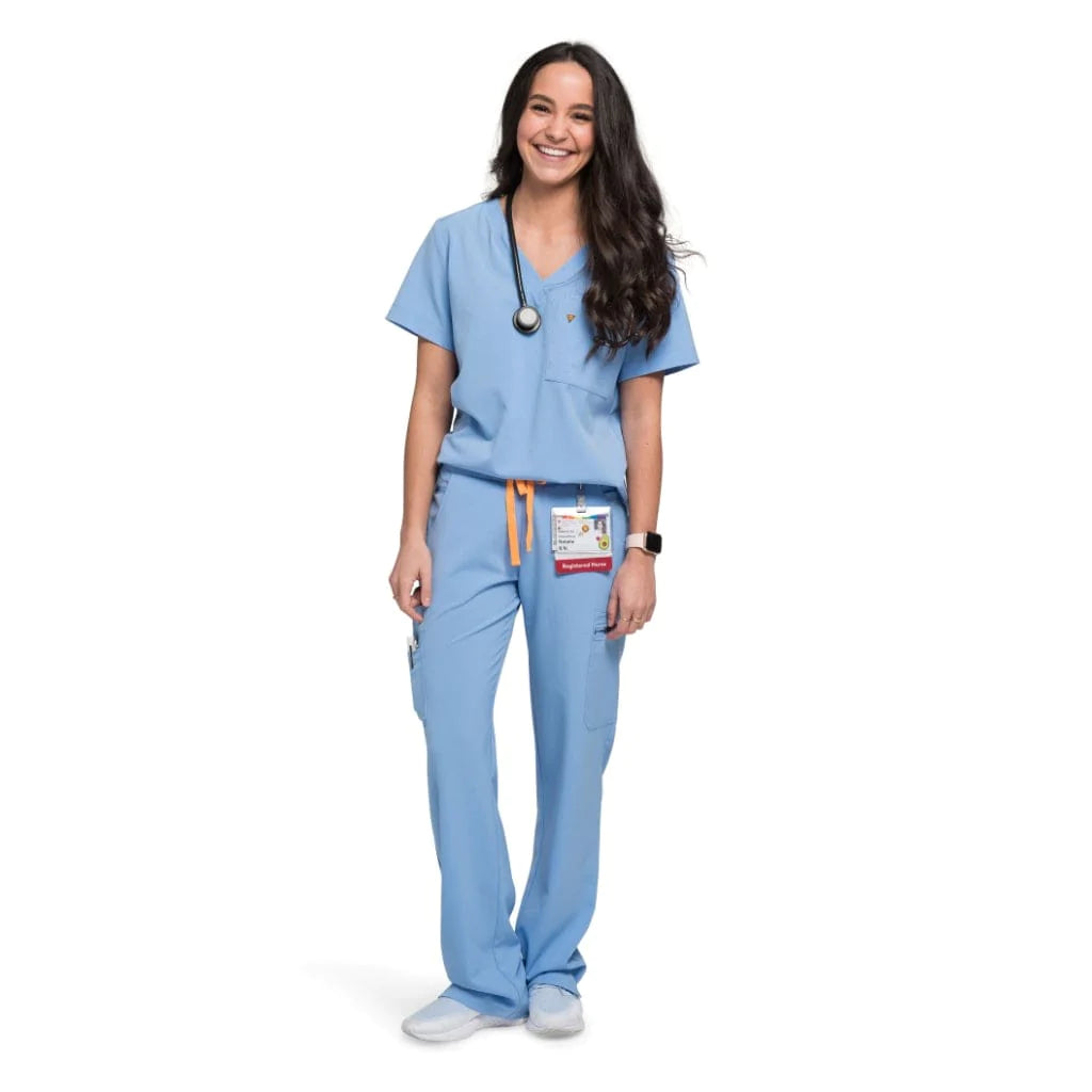 Full body picture of the the Bodie scrub pants in ceil blue.