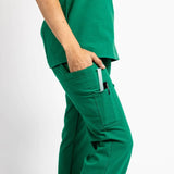 Close up picture of the the Bodie scrub pants in Hunter Green.