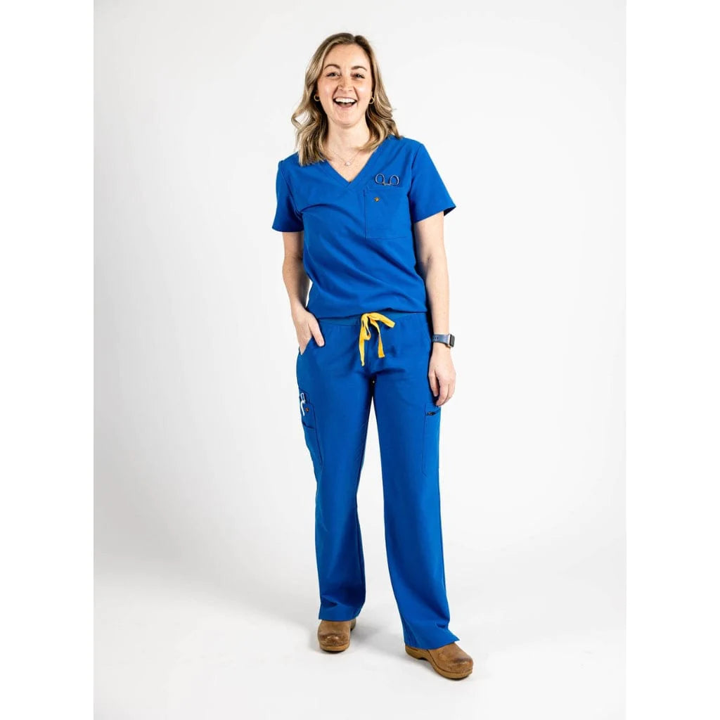 Full body picture of the the Bodie scrub pants in royal blue.