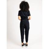 Back side full body picture of the the Hatton jogger scrub pants in black.