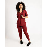Full body picture of the the Hatton jogger scrub pants in burgundy.