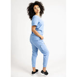 Side full body picture of the the Hatton jogger scrub pants in ceil blue.