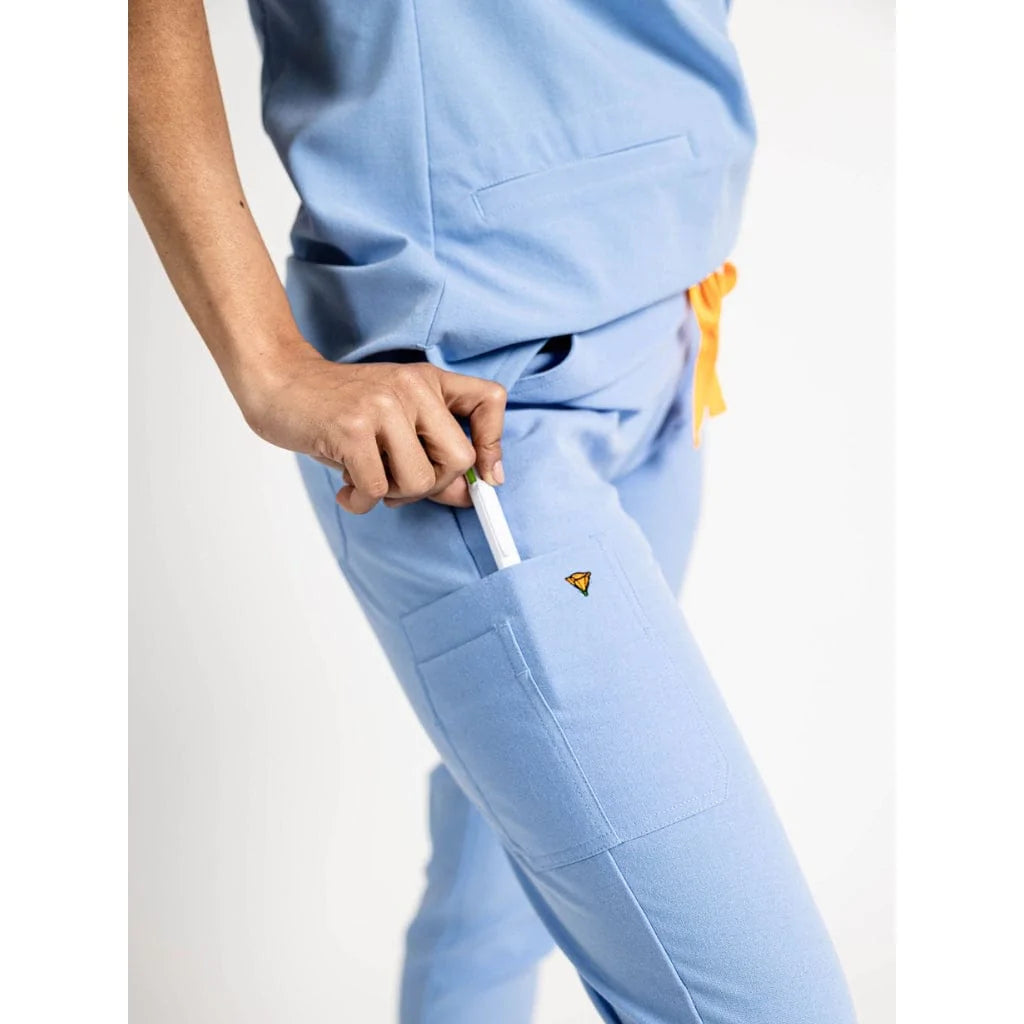 Pocket detail picture of the the Hatton jogger scrub pants in ceil blue.