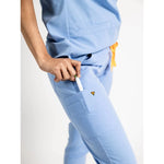 Pocket detail picture of the the Hatton jogger scrub pants in ceil blue.