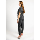 Back side full body picture of the the Hatton jogger scrub pants in charcoal gray.