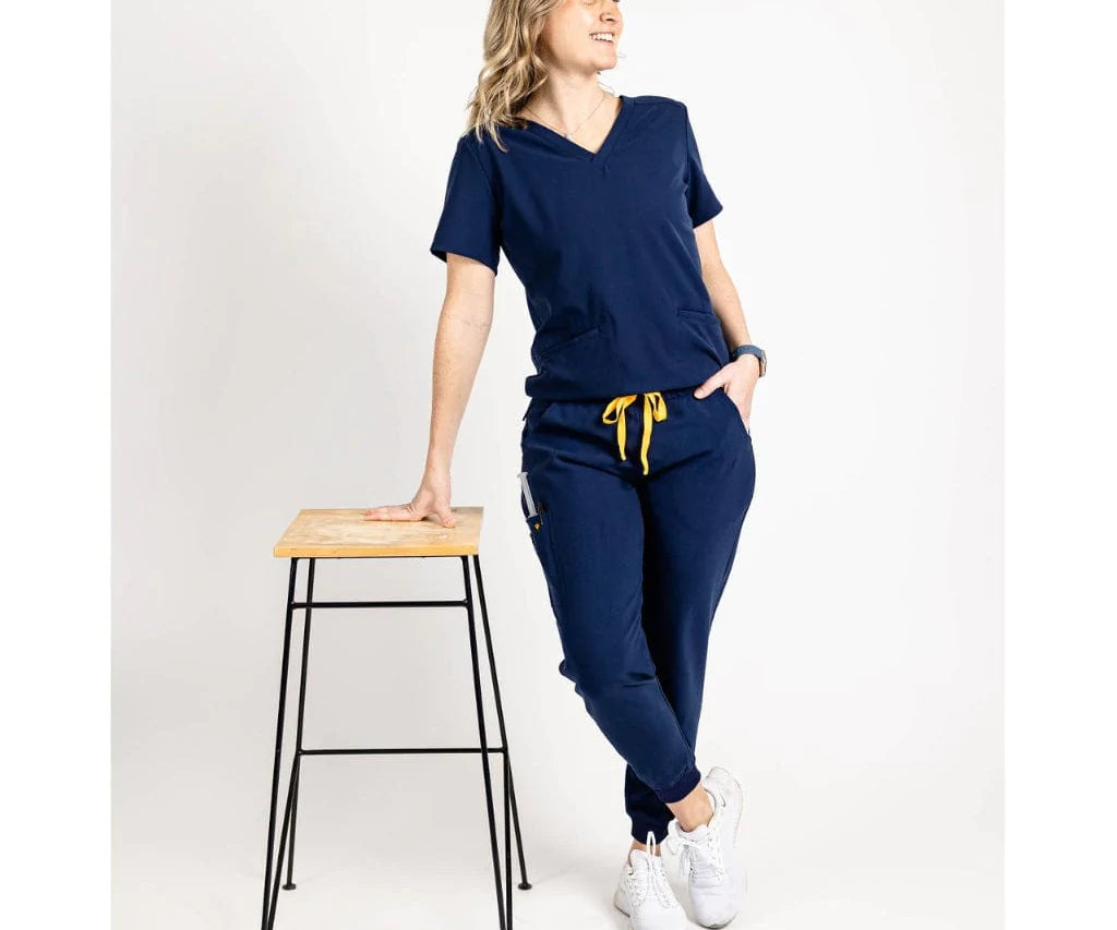 Full body picture of the the Hatton jogger scrub pants in navy blue.