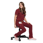 Seated lower front picture of the the Pfeiffer scrub pants in burgundy.