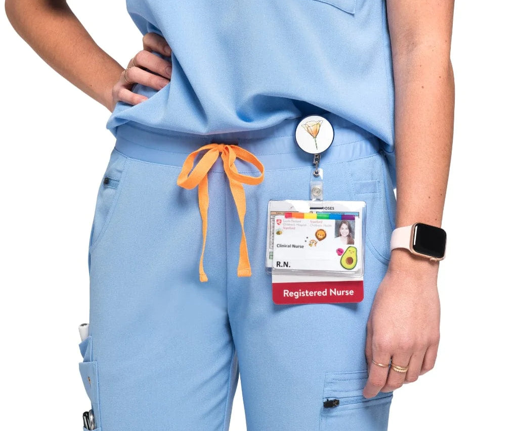 Close up full body picture of the the Pfeiffer scrub pants in ceil blue.