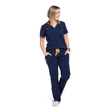 Full body picture of the the Bodie scrub pants in navy blue.