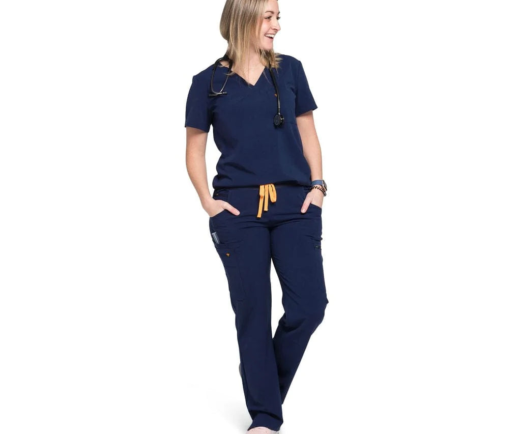 Full body picture of the the Bodie scrub pants in navy blue.