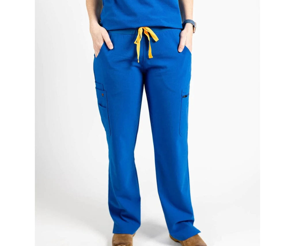 Full body picture of the the Bodie scrub pants in royal blue.