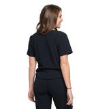 Back side picture of the the Caswell scrub top in black.