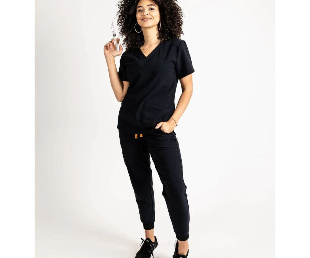 Full body picture of the the Caswell scrub top in black.
