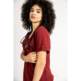 Sleeve detail picture of the the Caswell scrub top in burgundy.