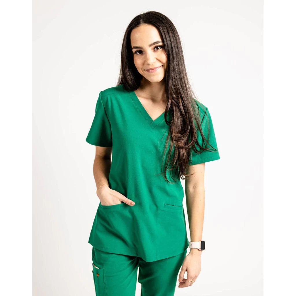 Upper front picture of the the Caswell scrub top in hunter green.