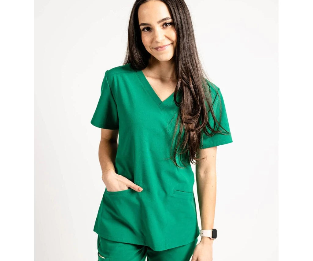 Upper front picture of the the Caswell scrub top in hunter green.