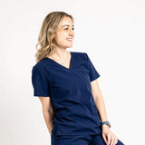Upper front picture of the the Caswell scrub top in navy blue.