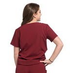 Back picture of the wilder one-pocket scrub top in burgundy.