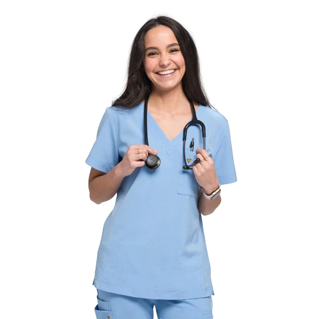 Front shot of the wilder one-pocket scrub top in ceil blue.
