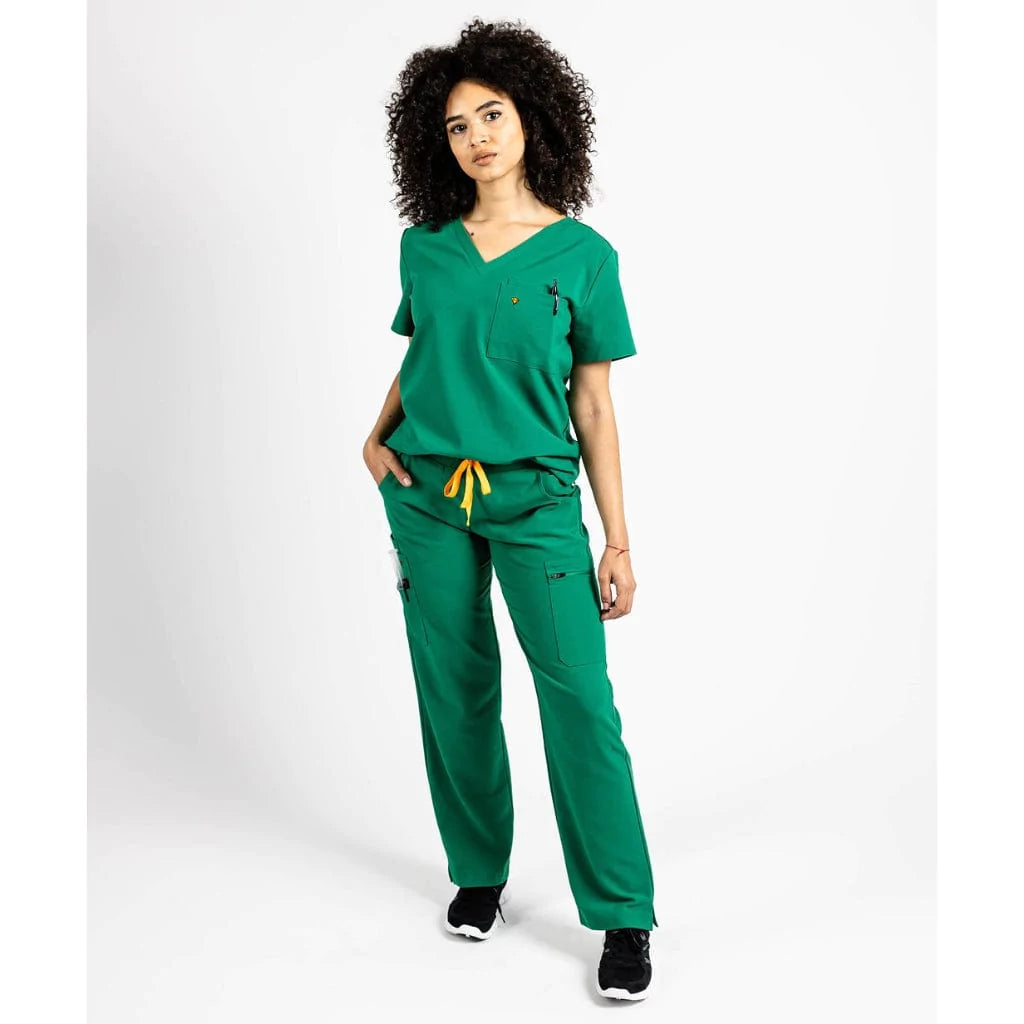 Full body picture of the wilder one-pocket scrub top in hunter green.