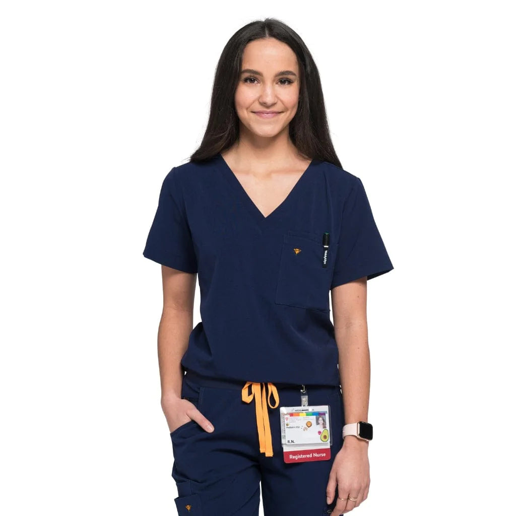 Front shot of the wilder one-pocket scrub top in navy blue.