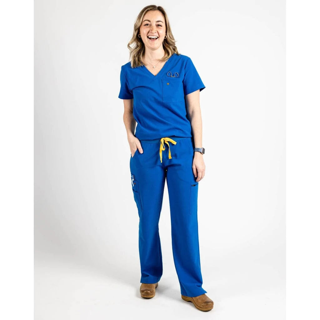 Full body picture of the wilder one-pocket scrub top in royal blue.