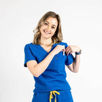 Front shot of the wilder one-pocket scrub top in royal blue.