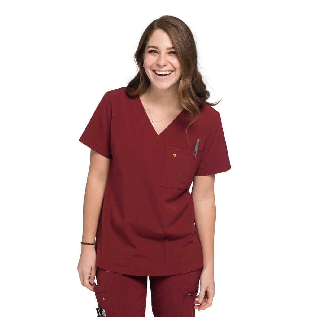 Front shot of the wilder one-pocket scrub top in burgundy.