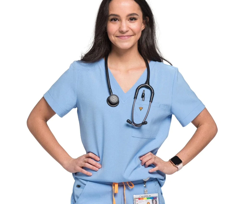 Front shot of the wilder one-pocket scrub top in ceil blue.