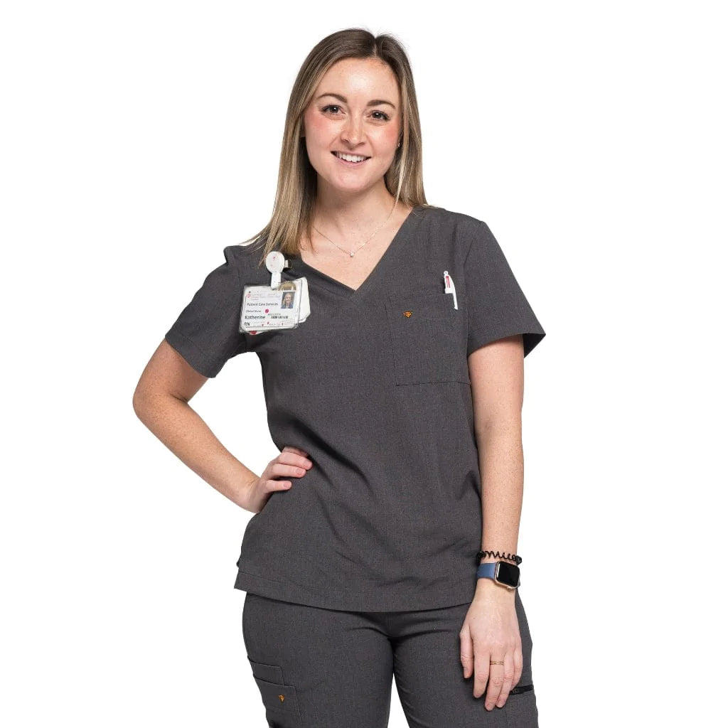 Front shot of the wilder one-pocket scrub top in charcoal gray.