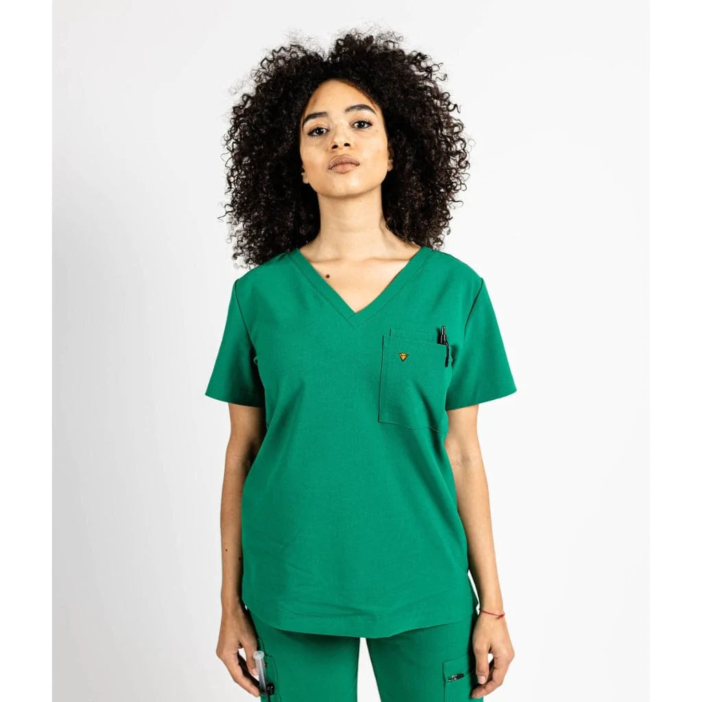 Front shot of the wilder one-pocket scrub top in hunter green.